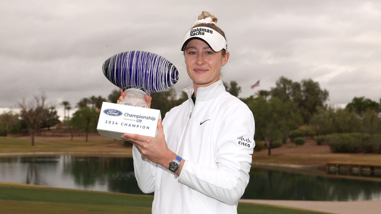 Nelly Korda holds the Ford Championship trophy