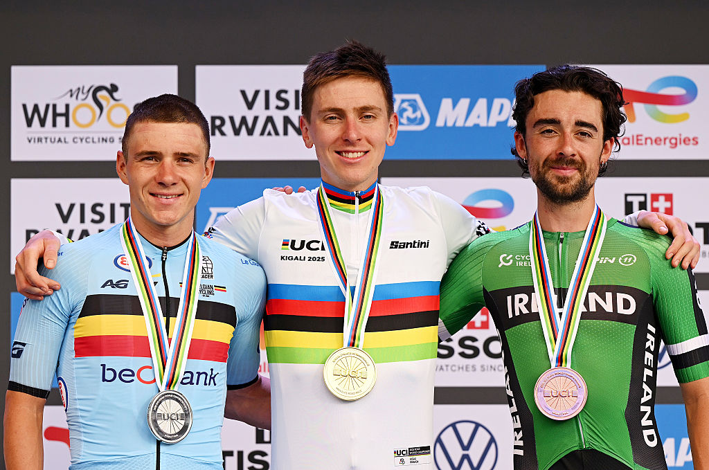 KIGALI, RWANDA - SEPTEMBER 28: (L-R) Silver medalist Remco Evenepoel and Team Belgium, gold medalist Tadej Pogacar and Team Slovenia and bronze medalist Ben Healy and Team Ireland pose on the podium during the medal ceremony after the 98th UCI Cycling World Championships Kigali 2025, Men Elite Road Race a 267.5km race from Kigali to Kigali on September 28, 2025 in Kigali, Rwanda. (Photo by Dario Belingheri/Getty Images)