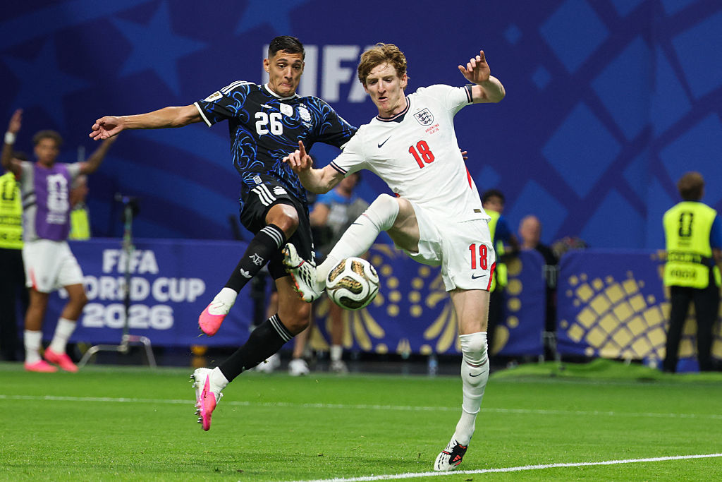 England's forward #18 Anthony Gordon scores his team's first goal past Argentina's defender #26 Nahuel Molina during the 2026 World Cup football tournament semi-final match between England and Argentina at the Atlanta Stadium in Atlanta on July 15, 2026. (Photo by Odd ANDERSEN / AFP)