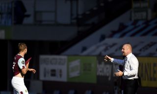 Burnley manager Sean Dyche and Matej Vydra on the touchline during the Premier League match at Turf Moor, Burnley