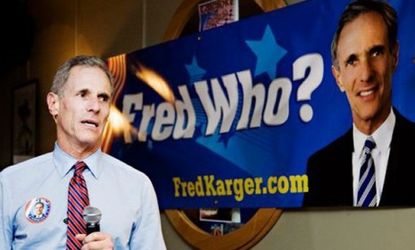 Potential republican presidential candidate Fred Krager speaks in New Hampshire next to campaign slogan that pokes fun of his behind-the-scenes experience.