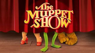 A screenshot of Kermit's legs behind a red stage curtain during The Muppet Show.