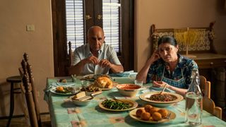 Lino's parents sitting down for dinner at their Sicily home