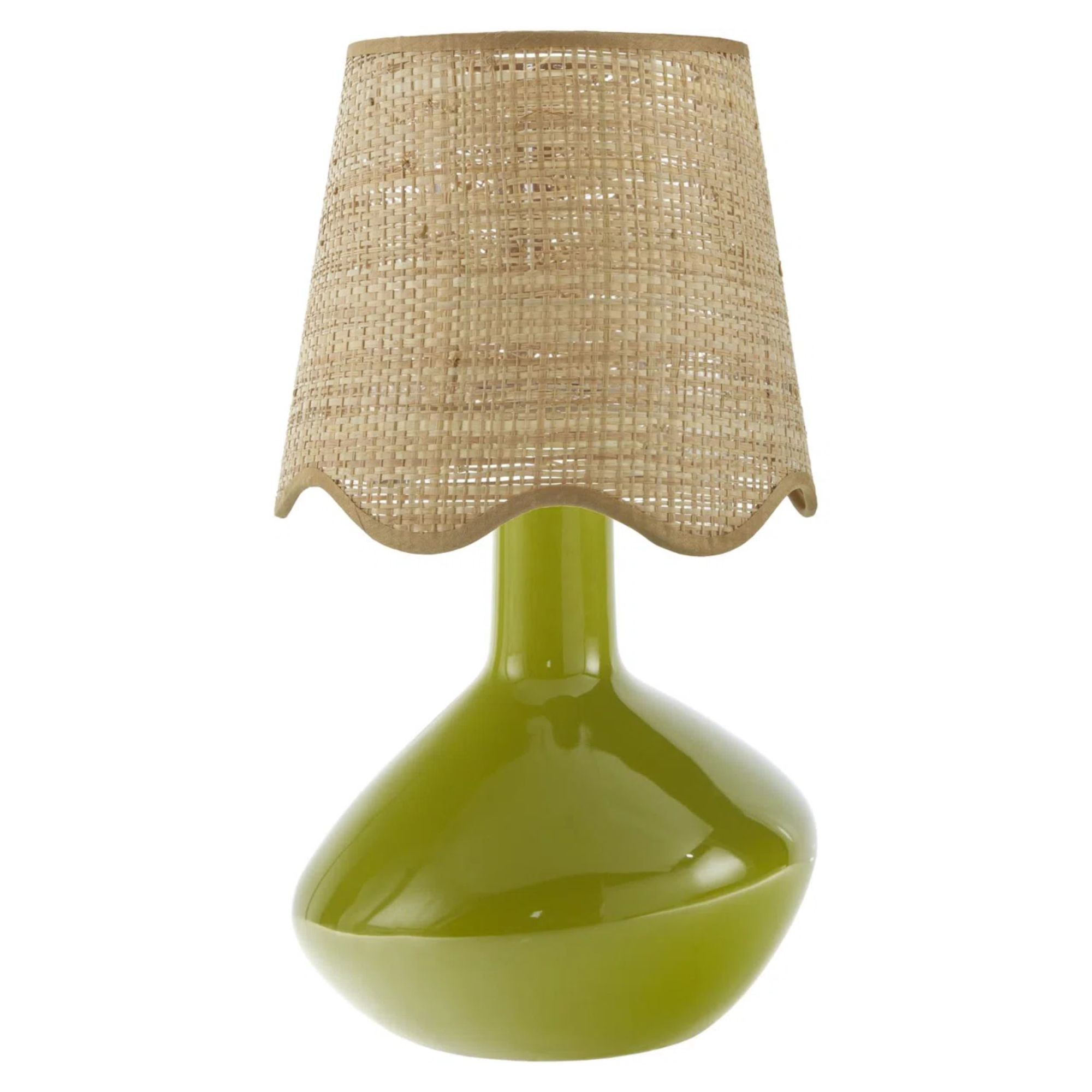 A green ceramic lamp with a scalloped rattan shade