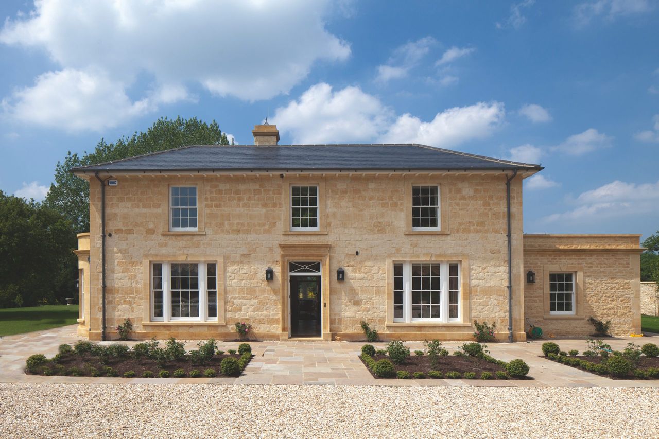 A new country house in warm golden stone, by Neil Quinn of Yiangou Architects