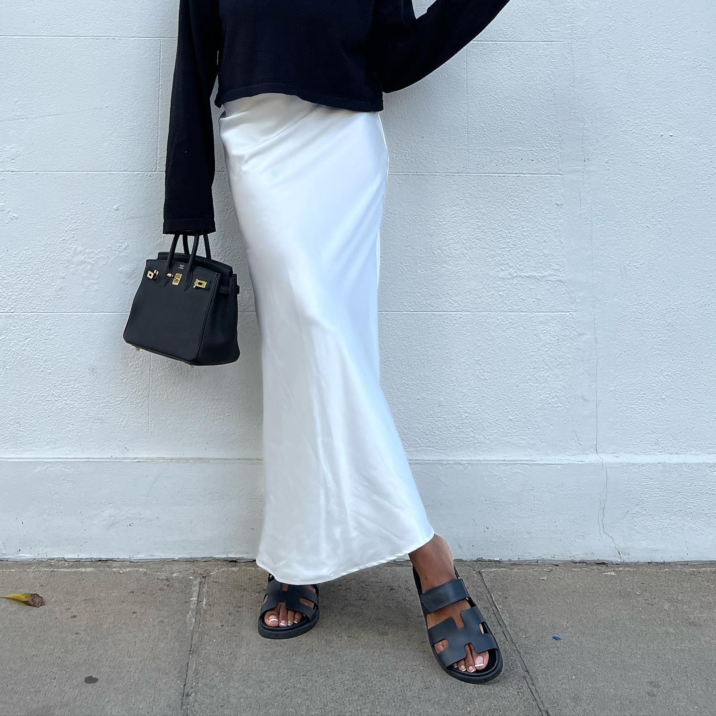 An image of @nlmarilyn wearing one of the most iconic shoes, Hermes Oran.