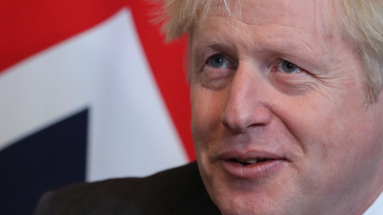 Boris Johnson during an event at 10 Downing Street with a Union flag behind him.