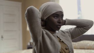 Jayme Lawson as Betty Shabazz covering her hair in Genius: MLK/X episode 5
