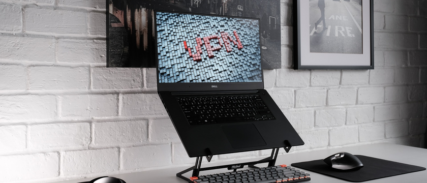 Laptop in home office with stylised letters VPN on the screen