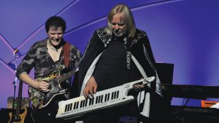 Caped crusader: Rick Wakeman whips out his keytar to duel with Trevor Rabin.