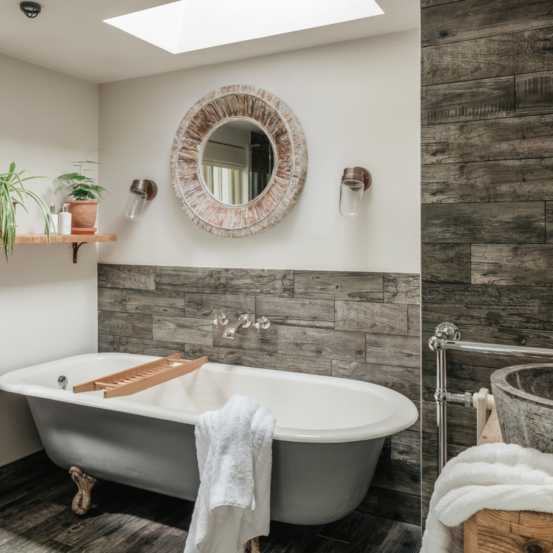 Bathroom in Unique Homestays x The White Company house, with freestanding bath, mirror and sink