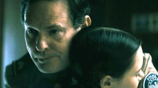 Henry Thomas holds his on-screen daughter in a hug in The Curse of the Necklace.