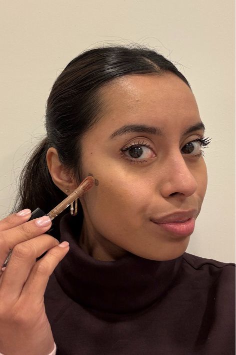 Ruby Ford-Dunker testing the Saie Dew Bronze Soft-Focus Sculpting Liquid Bronzer.