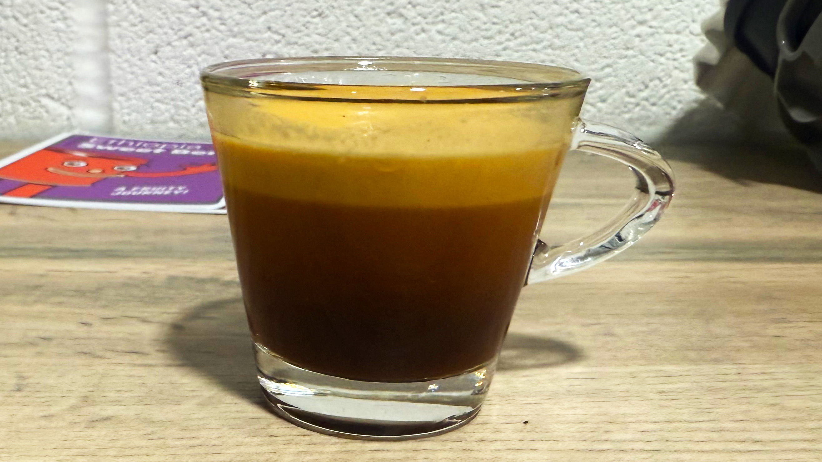 a shot of espresso made on the gevi espresso machine with grinder