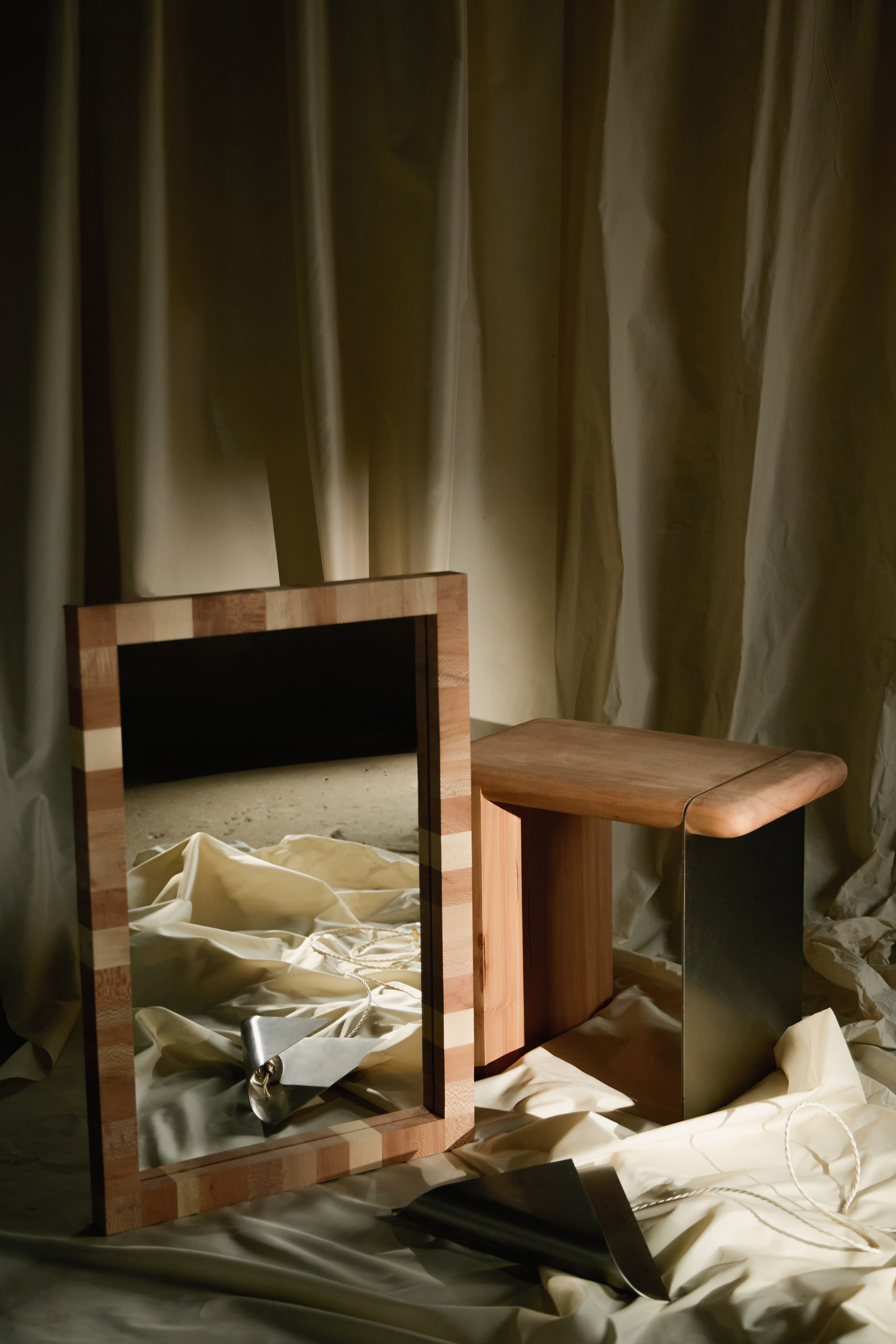 mirror with checkered frame and stool with a steel leg made from London Plane timber