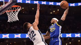 Gary Payton II #0 of the Golden State Warriors dunks against Desmond Bane #22 of the Memphis Grizzlies