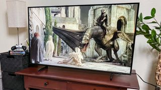 Samsung Q60D QLED TV on console in living room