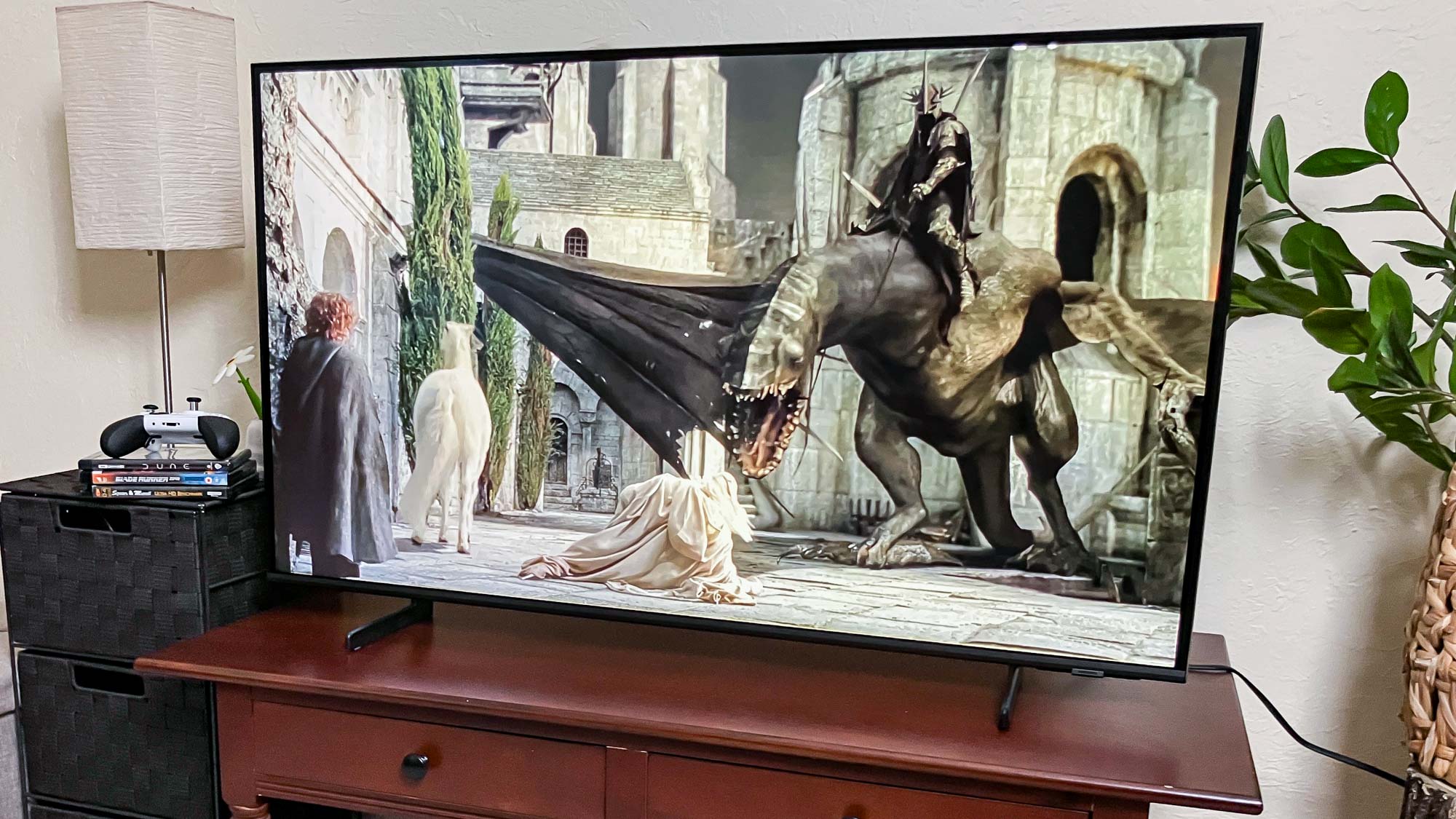 Samsung Q60D QLED TV on console in living room