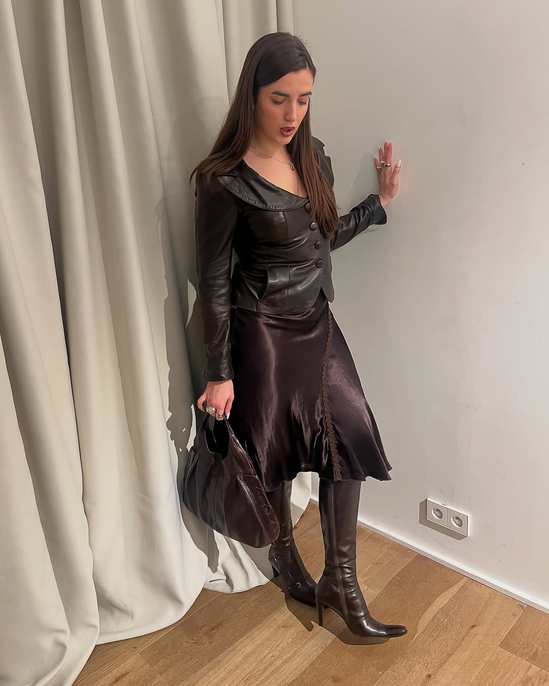 woman wearing knee high fitted boots