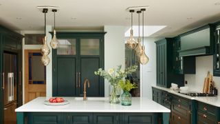 clusters of glass pendant lights over kitchen island