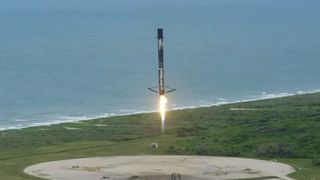 A SpaceX Falcon 9 rocket touches down at Cape Canaveral Space Force Station in Florida after launching the Transporter-2 rideshare mission to orbit, on June 30, 2021.
