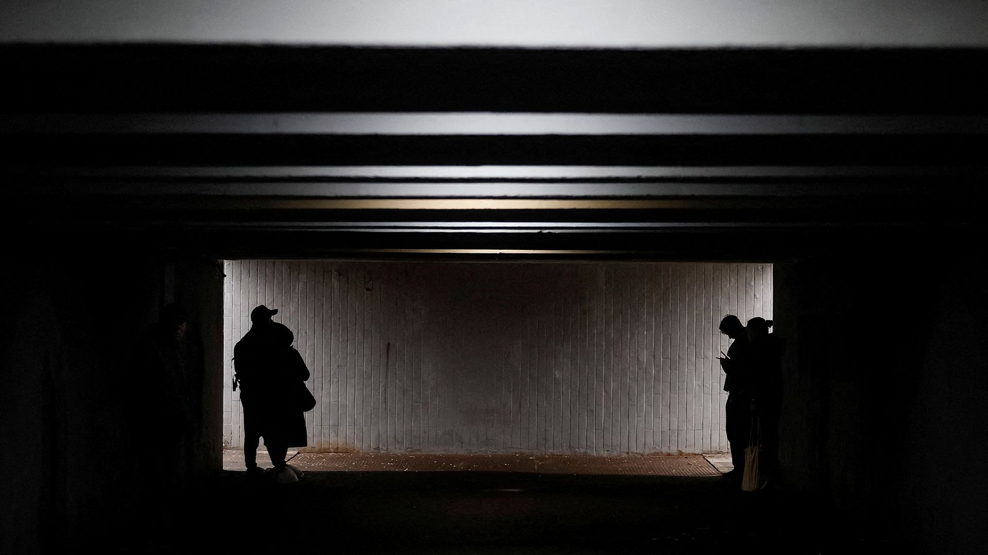 People take shelter in an underpass during a Russian air raid attack in Kyiv, Ukraine