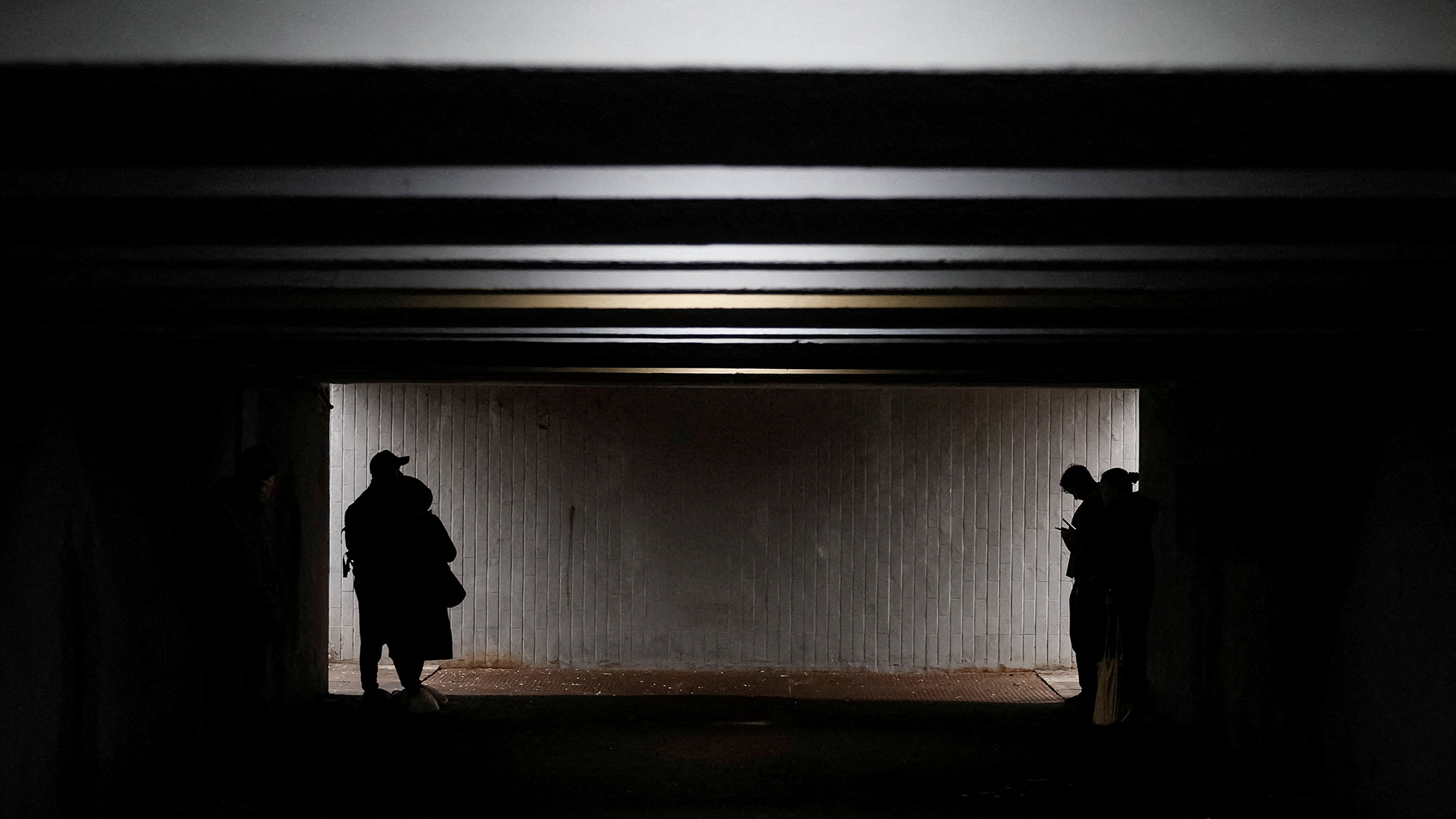 People take shelter in an underpass during a Russian air raid attack in Kyiv, Ukraine
