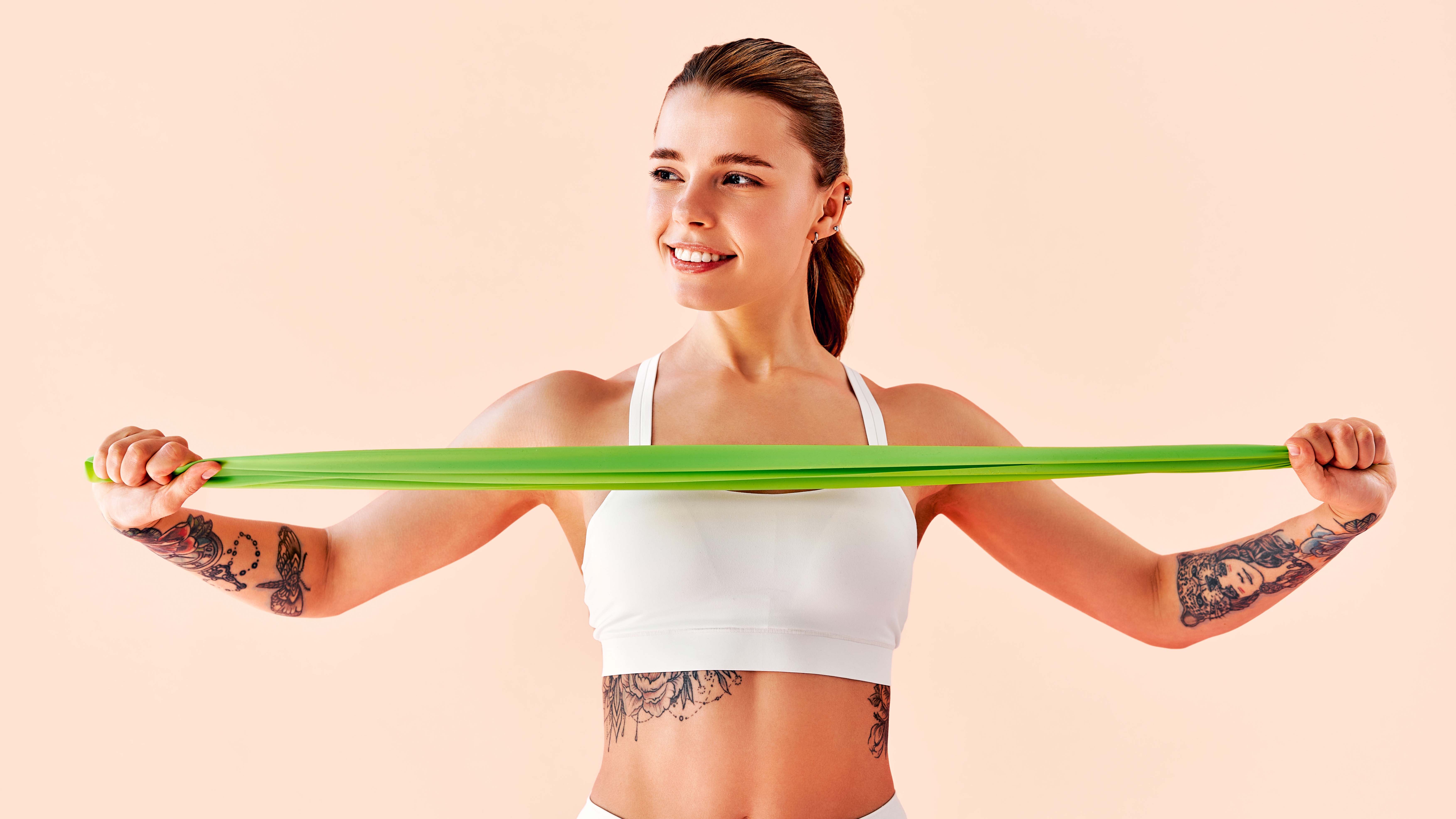 a photo of a woman holding a resistance band