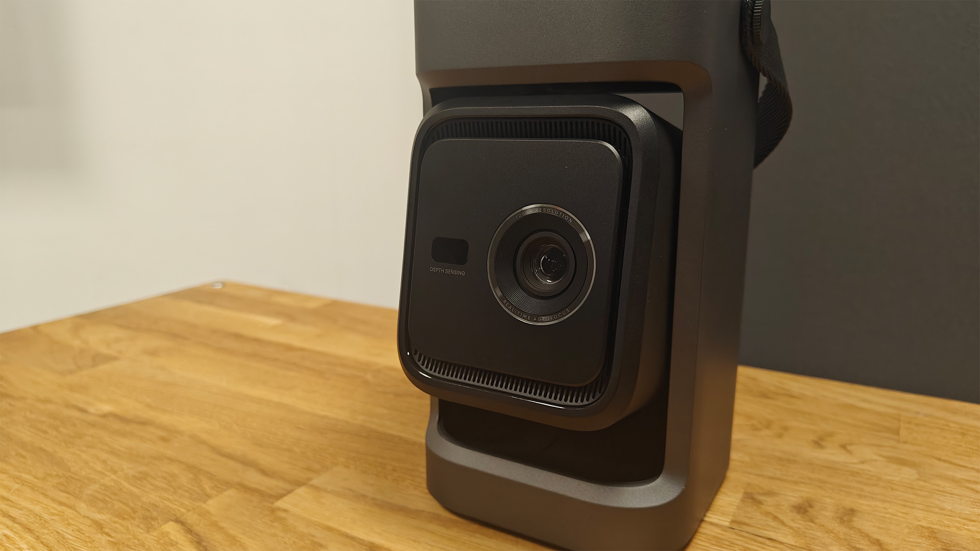 Soundcore Nebula P1 projector on wooden AV rack