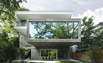 Canadian architect Angela Tsementzis’ Concrete House in Toronto is set within the leafy Moore Park Ravine