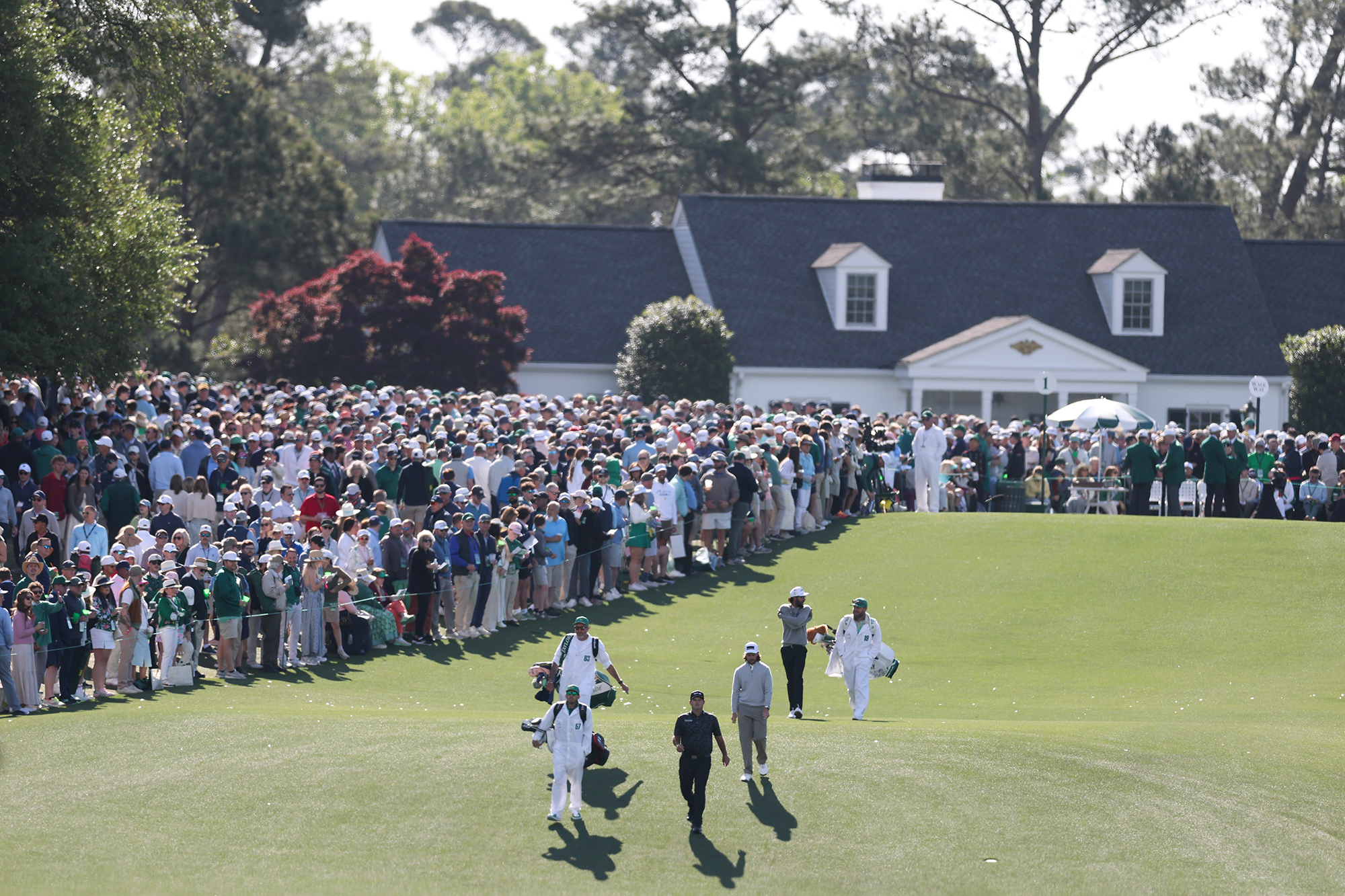 Patrick Reed, Tommy Fleetwood and Akshay Bhatia playing together in a group at the 2026 Masters Tournament