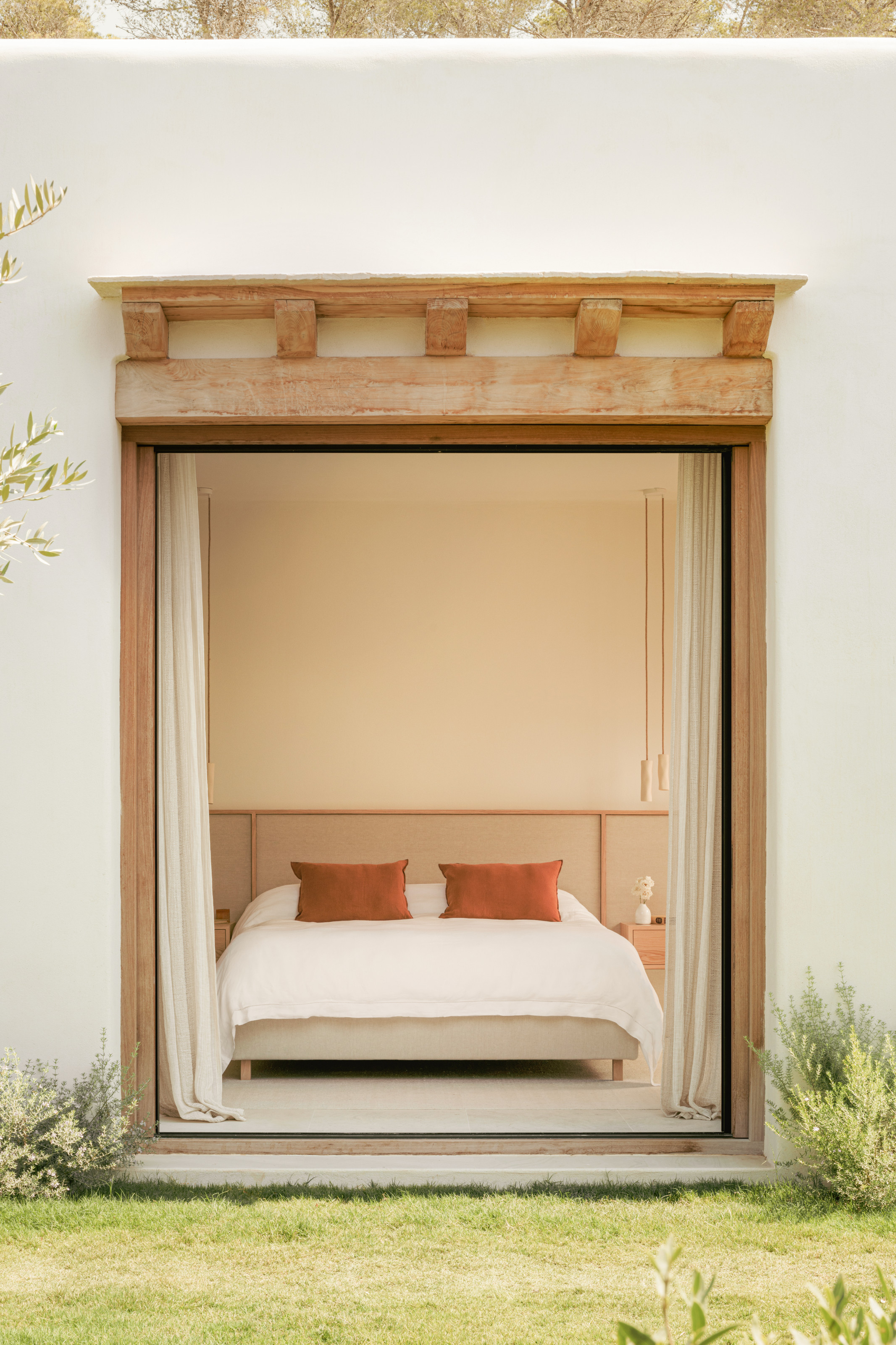 View of bedroom through the doors from the garden