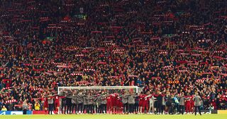 Anfield: Liverpool squad and backroom staff celebrate in front of the Kop after winning the UEFA Champions league semi-final second leg football match between Liverpool and Barcelona 4-0 at Anfield in Liverpool, north west England on May 7, 2019.