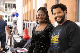 two people standing in a museum atrium