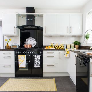 kitchen with white cabinet and black chimney