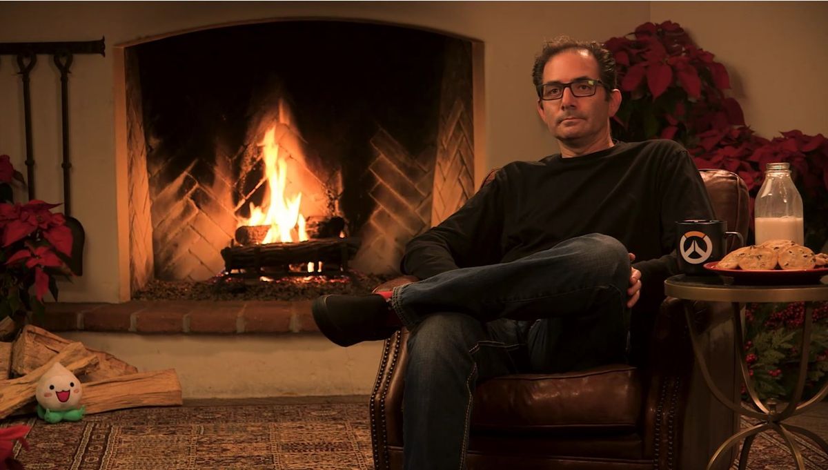 Overwatch Director Jeff Kaplan Is Sitting In Front Of A Fireplace