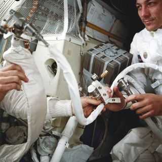 Apollo 13 astronauts piece together a makeshift rig to solve the carbon dioxide problem.