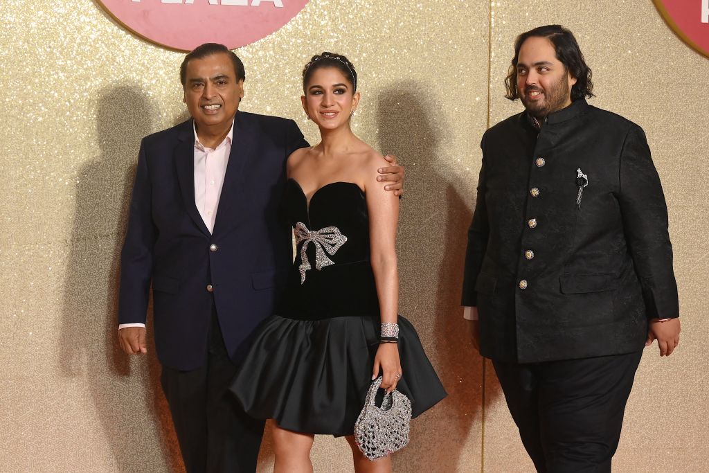Mukesh Ambani with Radhika Merchant and his son Anant Ambani