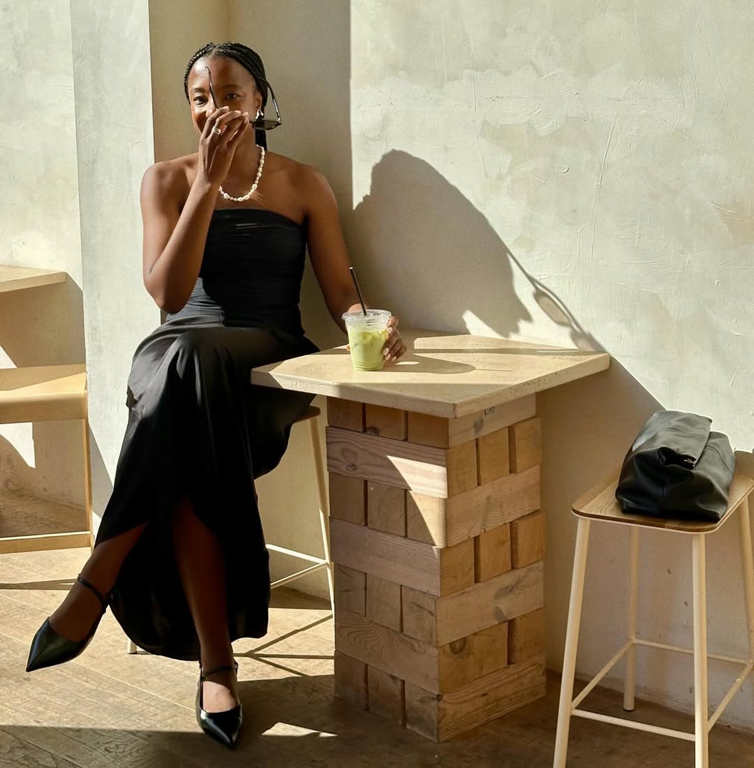 @taffymsipa wearing a black bandeau dress