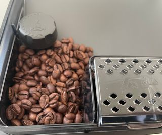 Philips 5400 Series LatteGo bean hopper with some coffee beans in