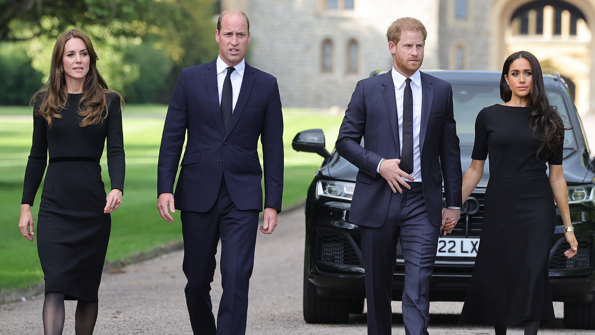 Catherine, Princess of Wales, Prince William, Prince of Wales, Prince Harry, Duke of Sussex, and Meghan, Duchess of Sussex on the long Walk at Windsor Castle arrive to view flowers and tributes to HM Queen Elizabeth on September 10, 2022 in Windsor, England. Crowds have gathered and tributes left at the gates of Windsor Castle to Queen Elizabeth II, who died at Balmoral Castle on 8 September, 2022. 