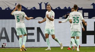 Niclas Fuellkrug (centre) celebrated a hat-trick as Werder Bremen inflicted more misery on Schalke
