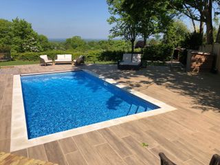 outdoor pool on deck by Home Counties Pools & Hot Tubs