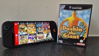 Switch 2 console with GameCube Nintendo Switch Online application on display next to game case for Doshin the Giant