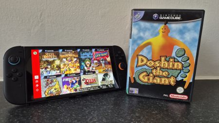 Switch 2 console with GameCube Nintendo Switch Online application on display next to game case for Doshin the Giant