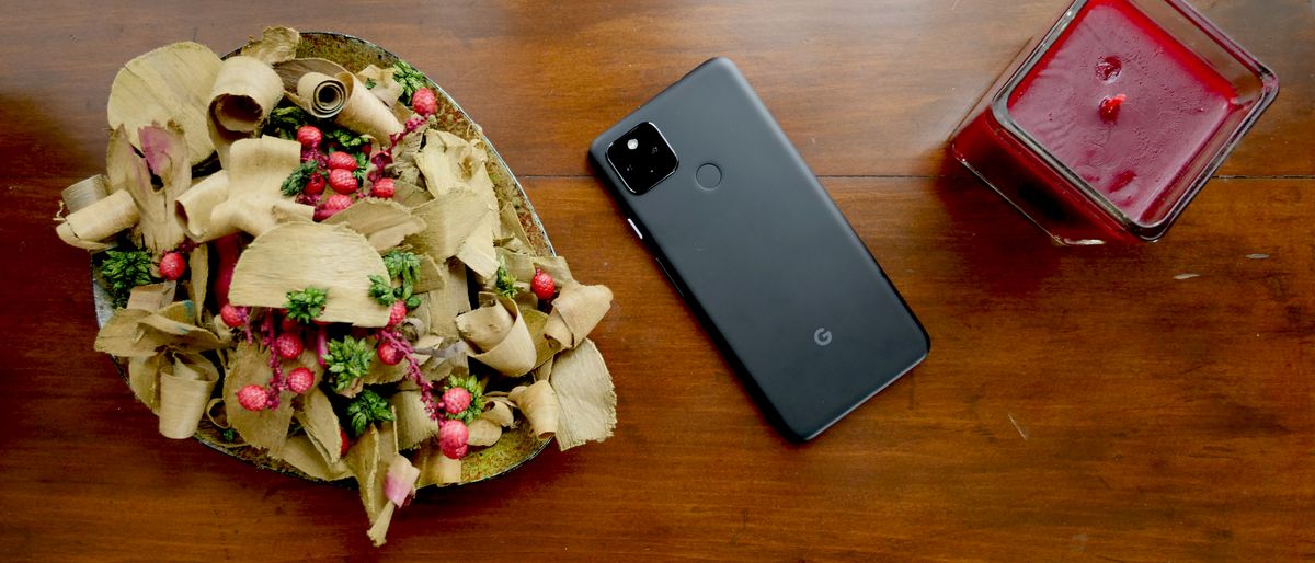 Pixel 4a 5G on side table with candle and potpourri