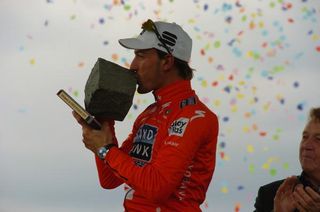 A romantic moment between Fabian Cancellara and his coveted cobble trophy.