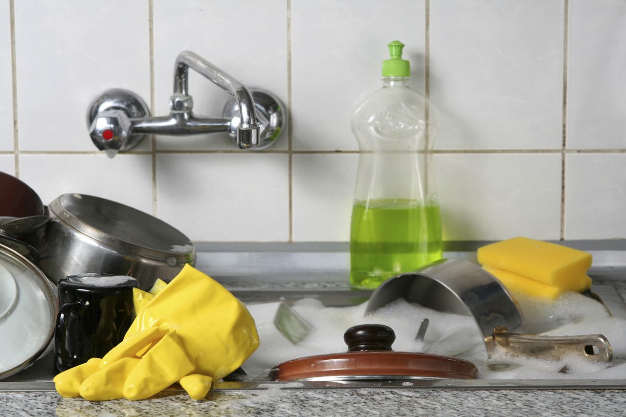 A sink full of dirty dishes.