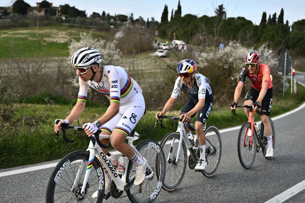 (From L) Team UAE's slovenain rider Tadej Pogacar, Team Q36.5's Thomas Pidcock and Team Ineos' Connor Swift lead the race during the 19th one-day classic Strade Bianche (White Roads) men's cycling race between Siena and Siena in Tuscany on March 8, 2025. (Photo by Marco BERTORELLO / AFP)