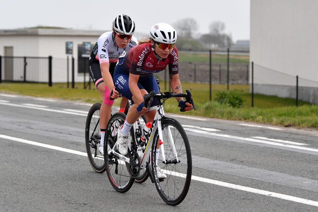 WEVELGEM BELGIUM MARCH 27 LR Anne Van Rooijen of Netherlands and Team Parkhotel Valkenburg and Gulnaz Khatuntseva of Russia and Team Roland Cogeas EdelweissIsraelPremier Tech during the 11th GentWevelgem In Flanders Fields 2022 Womens Elite a 159km one day race from Ypres to Wevelgem GWEwomen UCIWWT on March 27 2022 in Wevelgem Belgium Photo by Luc ClaessenGetty Images